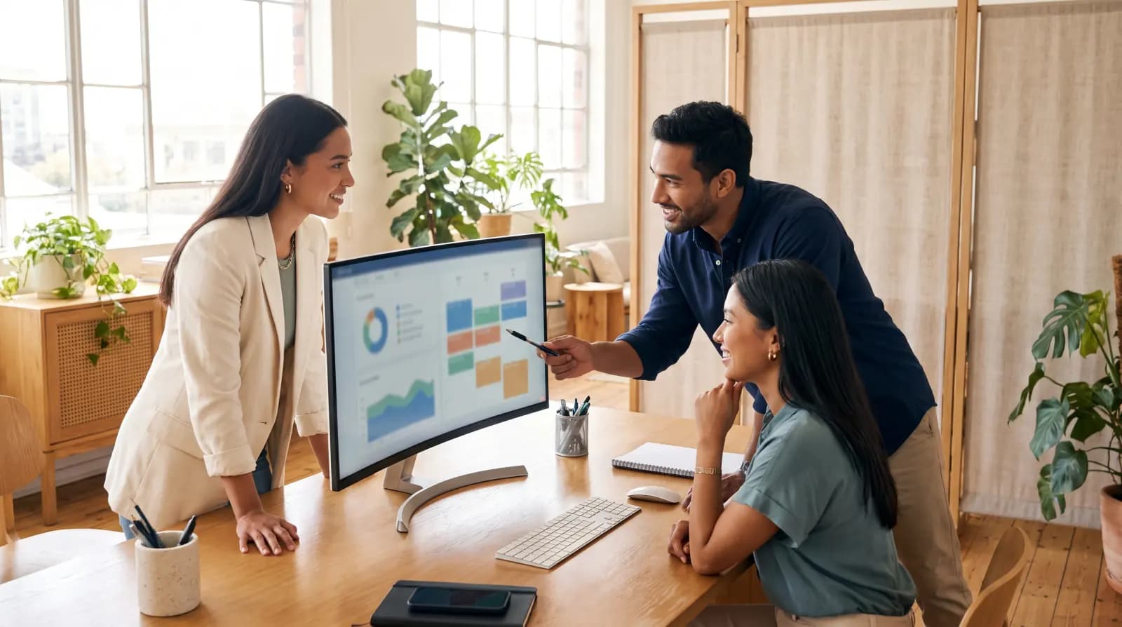 Marketing team planning a campaign together in a light-filled studio